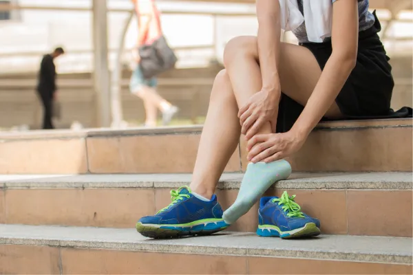 woman checking her ankle