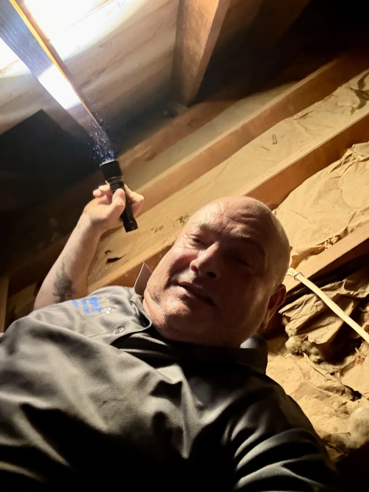 Two-story suburban house in heavy rainfall, showing roof, siding, and drainage performance during wet weather—ideal visual for rainy-day home inspection blog.