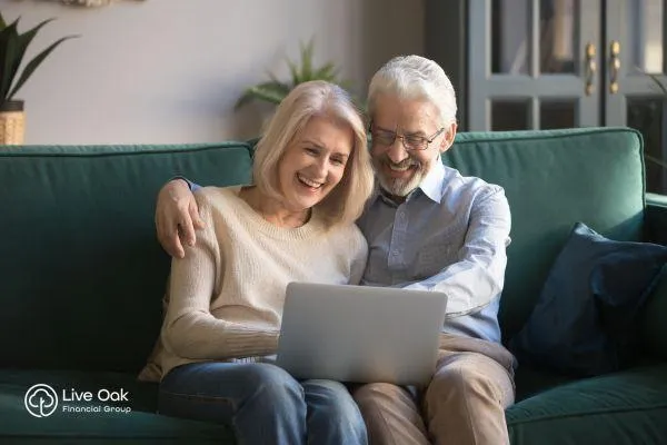 Retiree couple reviewing financial documents to maximize their Social Security benefits and plan for a secure retirement.