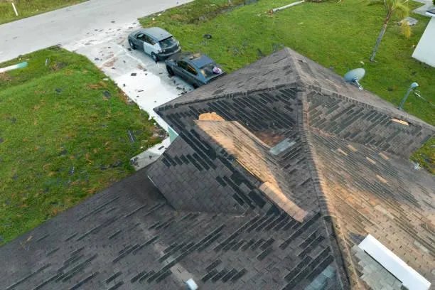 RJM roofing technician inspecting a storm-damaged roof in Port Chester