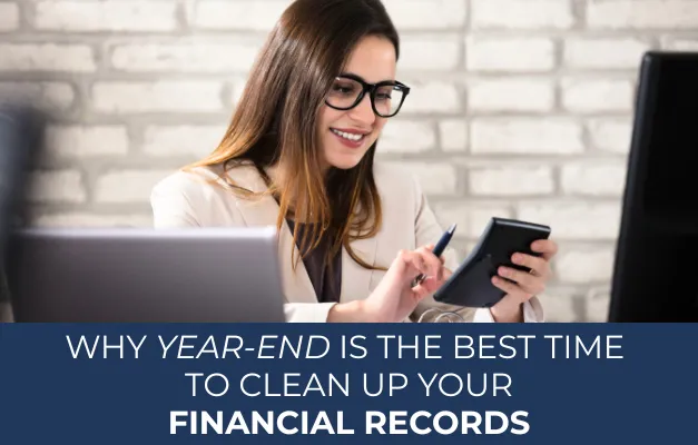 Accountant using calculator, with the title of the blog post at the bottom of the image