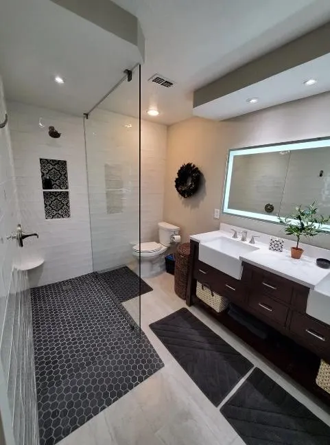 Modern bathroom featuring a smart mirror with built-in lighting and voice-activated controls.