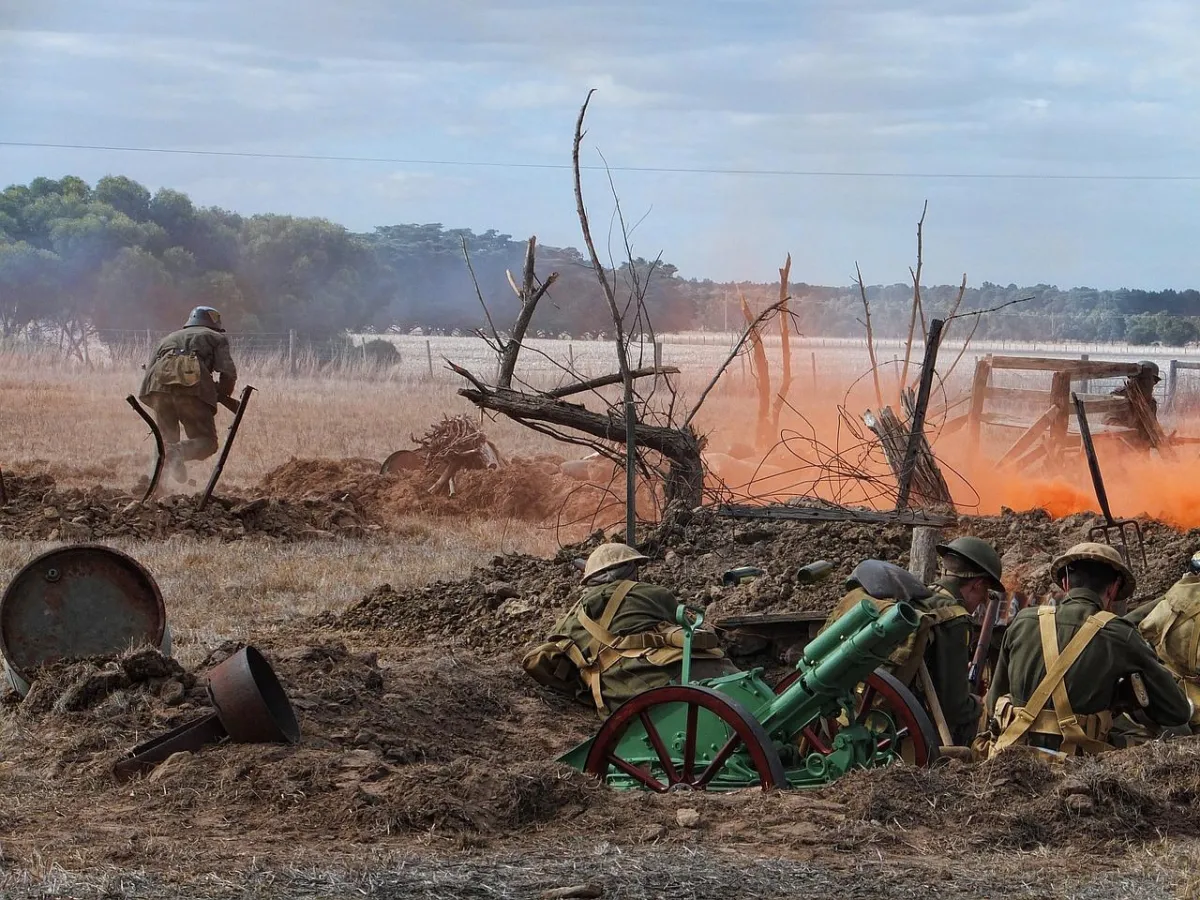 World War reenactment - soldiers in trenches and fire on the battlefield