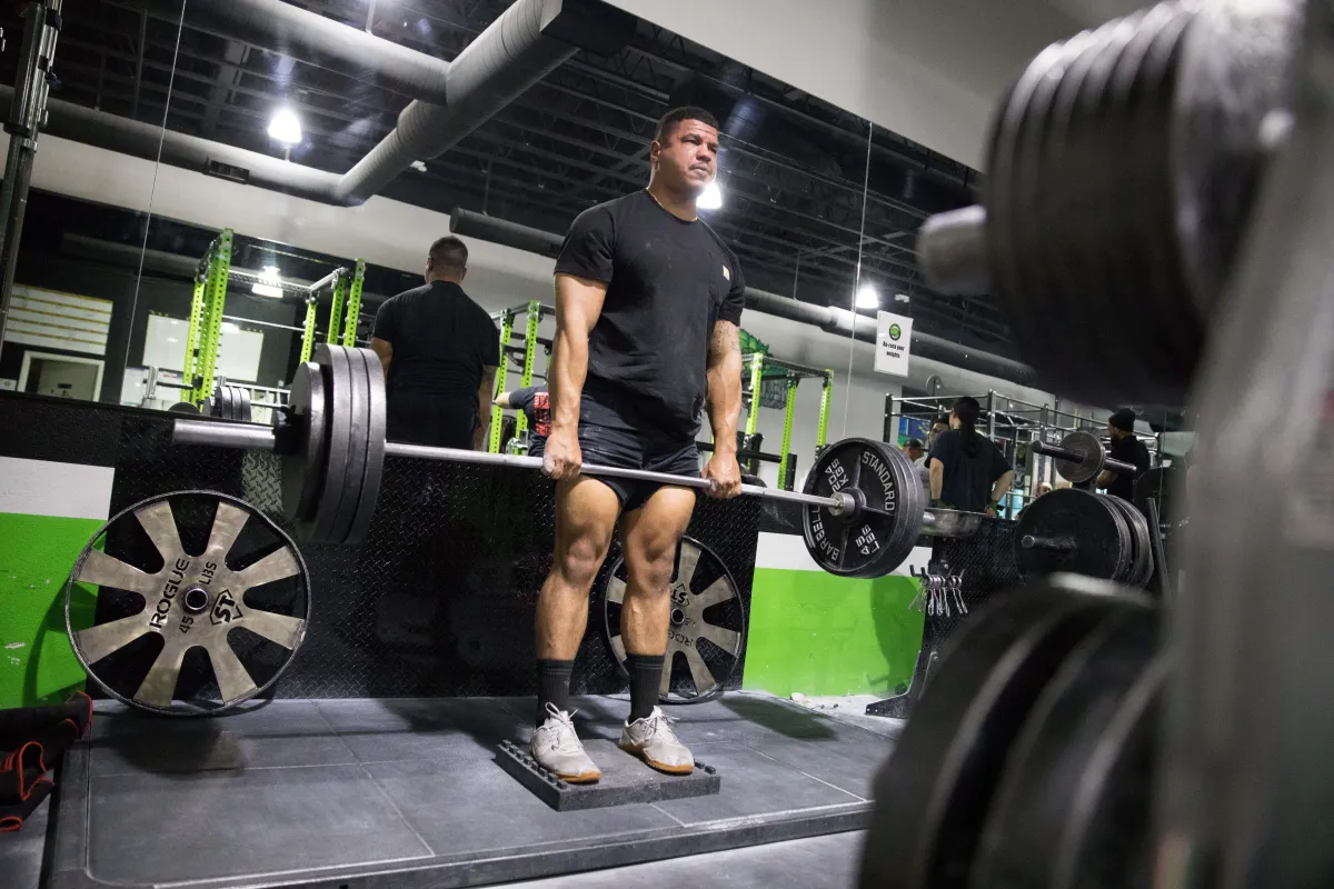 A powerlifter deadlifting on a deadlift platform