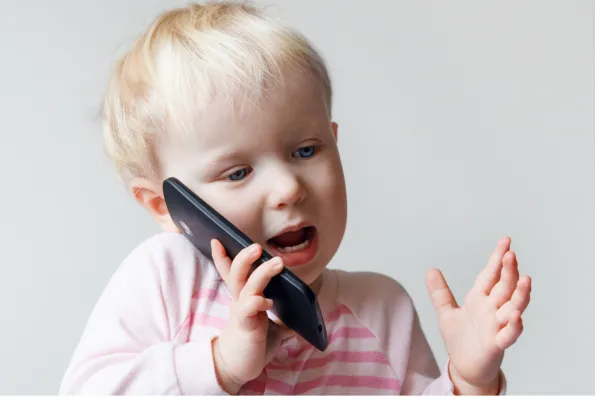 Toddler talking on phone