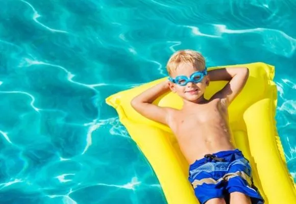 young boy pool