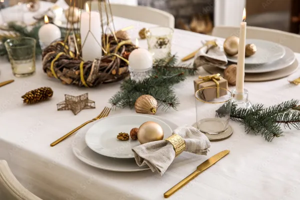 Beautiful table setting with Christmas decorations in living room