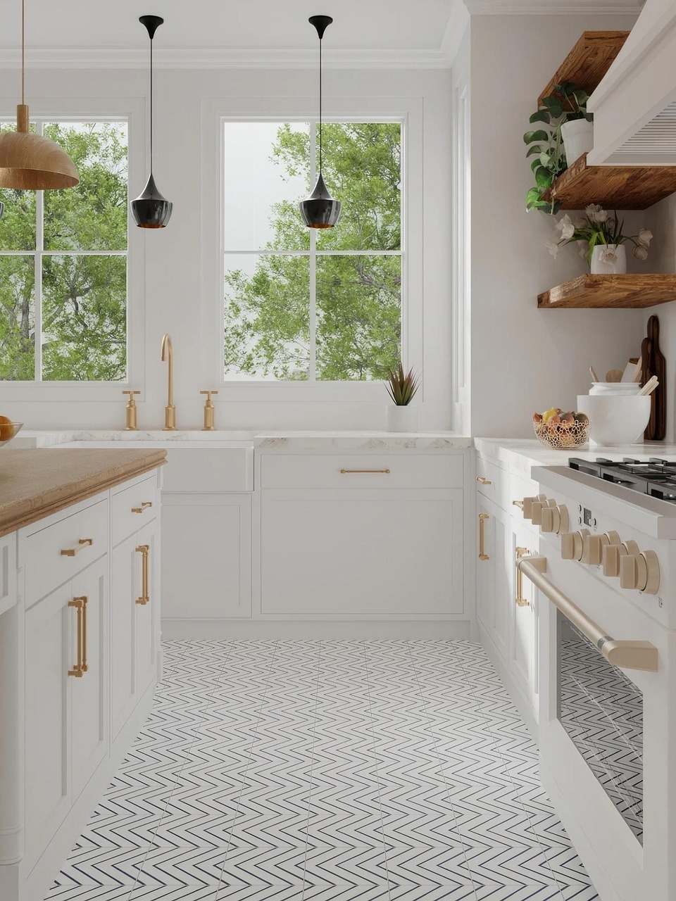 Modern white kitchen with brass hardware, open wood shelves, pendant lights, and chevron tile flooring.