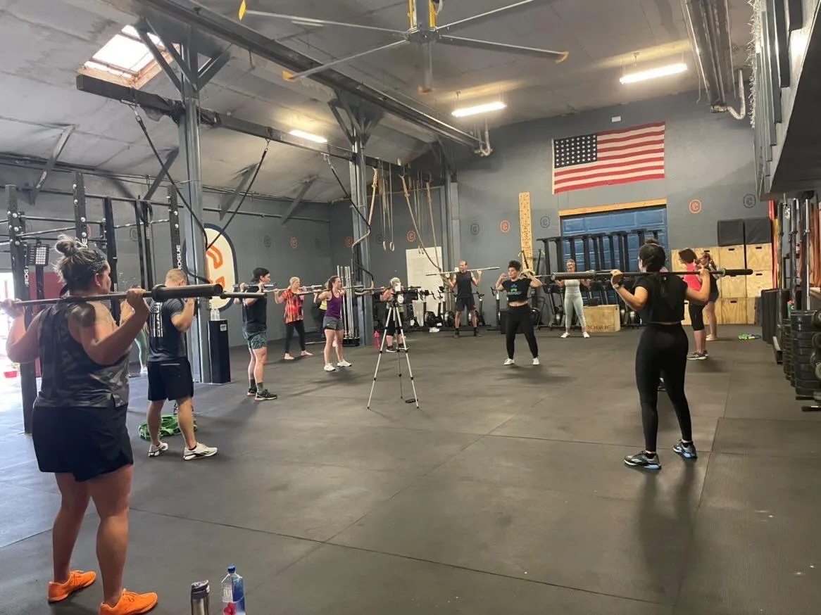 Dr. Kelly Alhooie teaches a workshop at a gym.