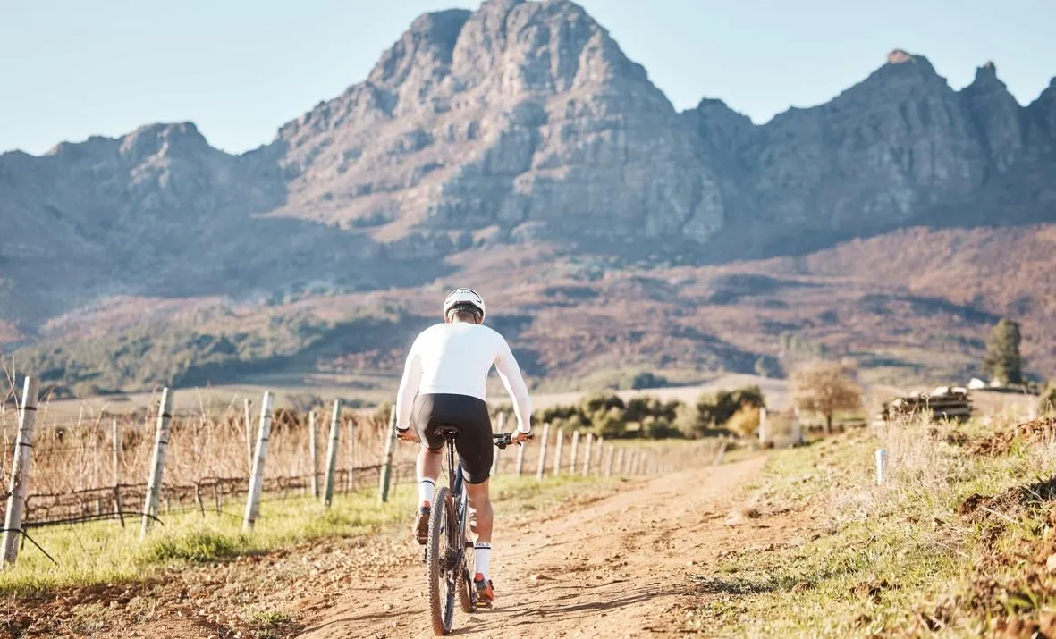 Image of a person riding a bike in a wide open space