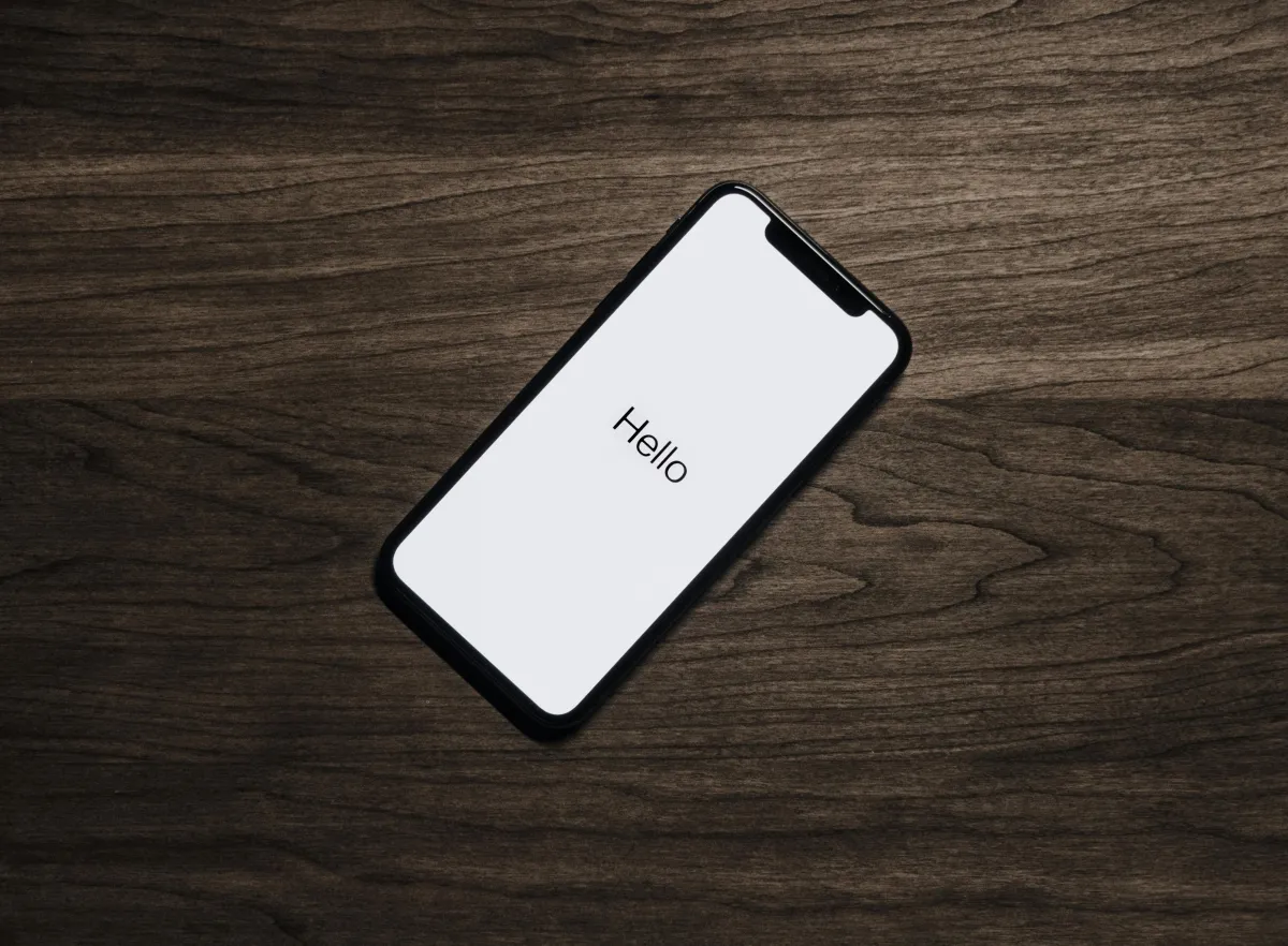 Cell phone displaying text " Hello"