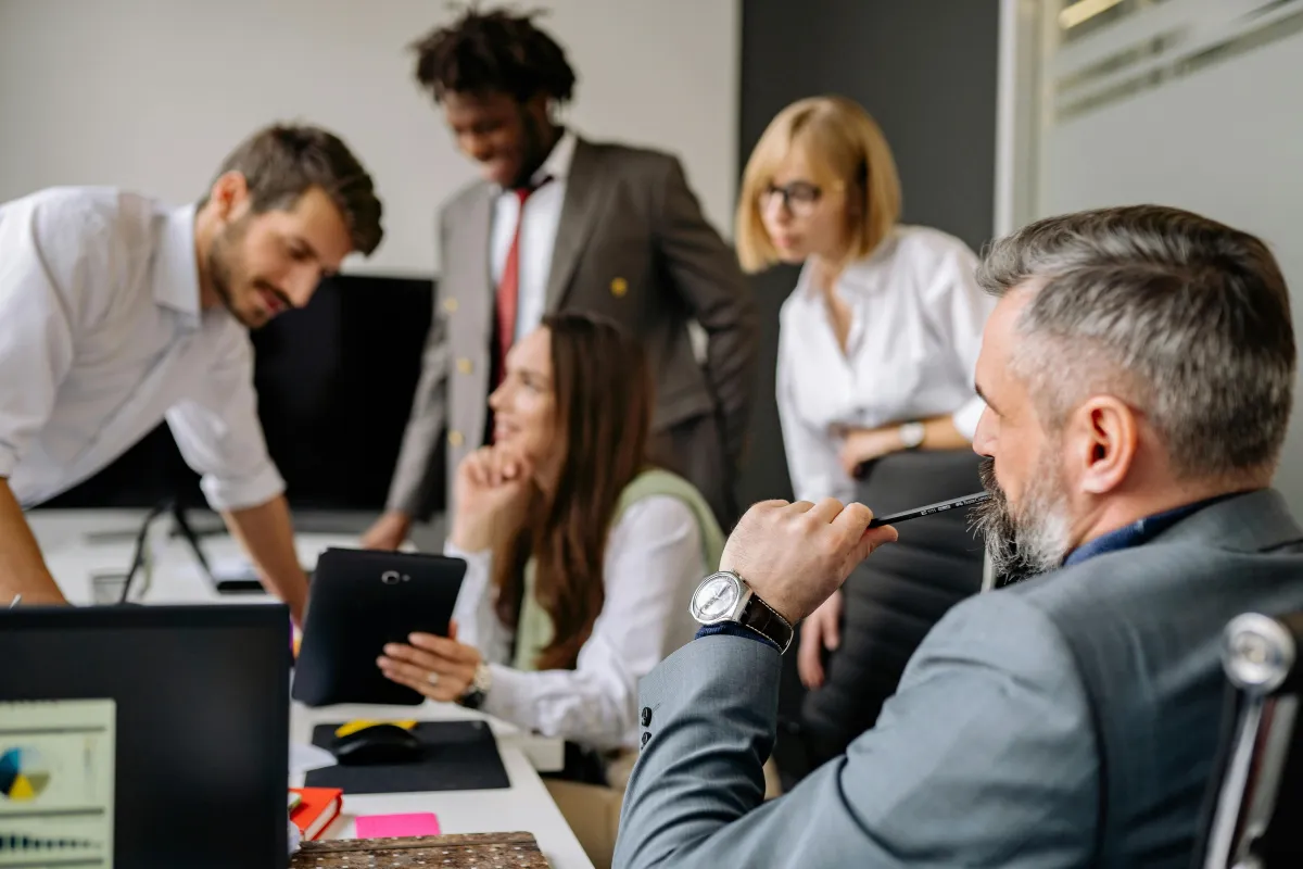 Business leader watching his employees