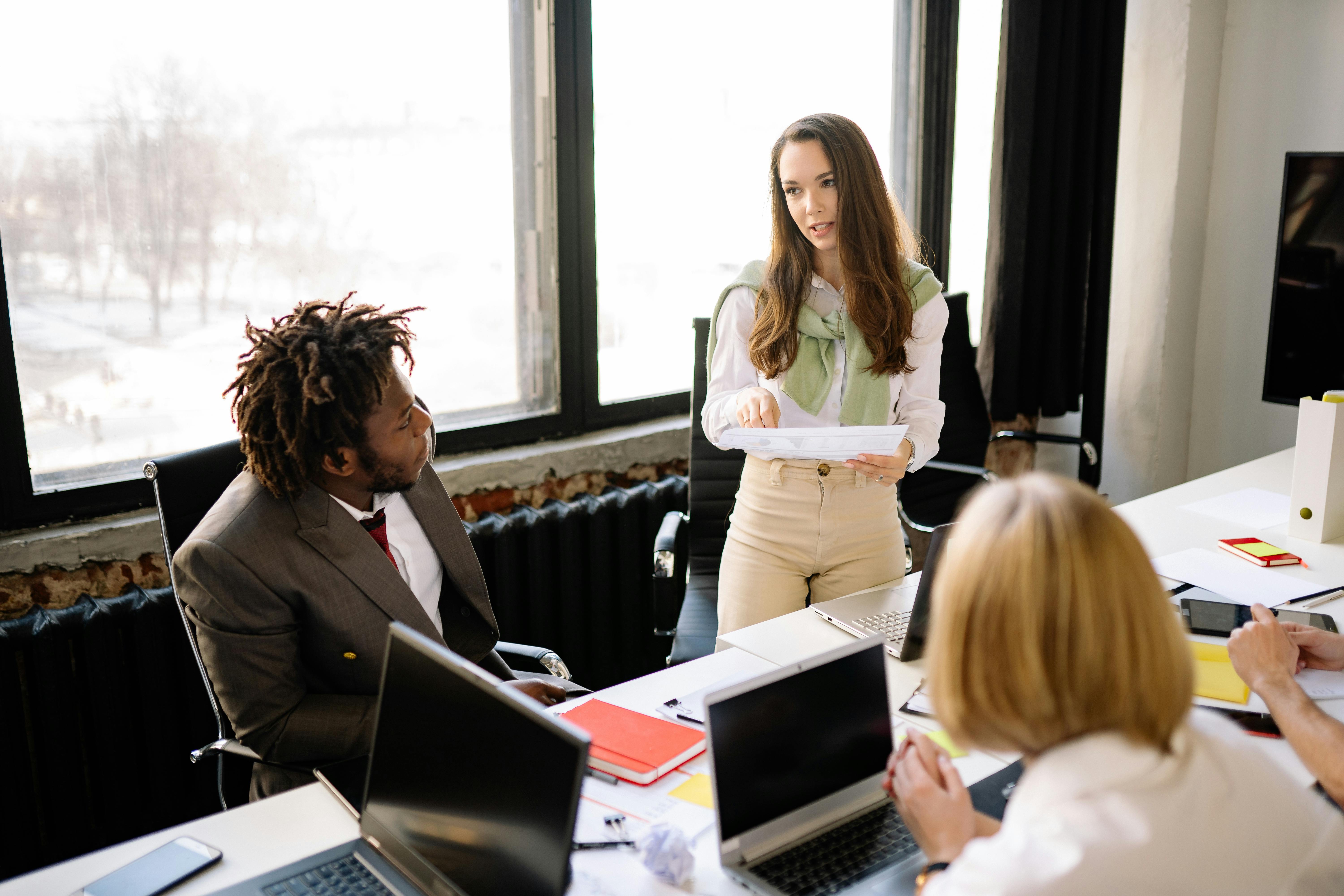Man and Woman Sitting on Chair in Front of Laptop Computer More info Share