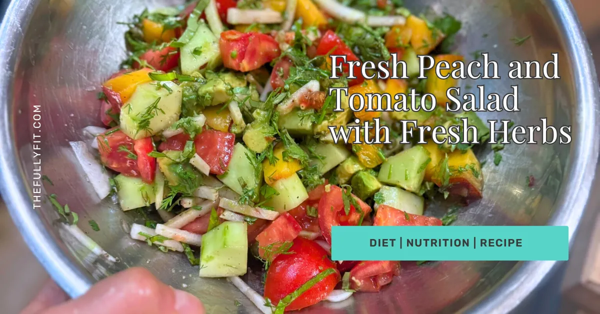 Fresh peach and tomato salad with cucumber and herbs in a bowl