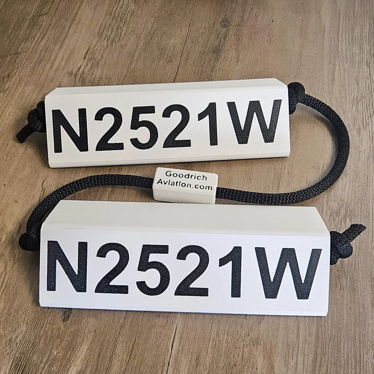 White base black letters black rope