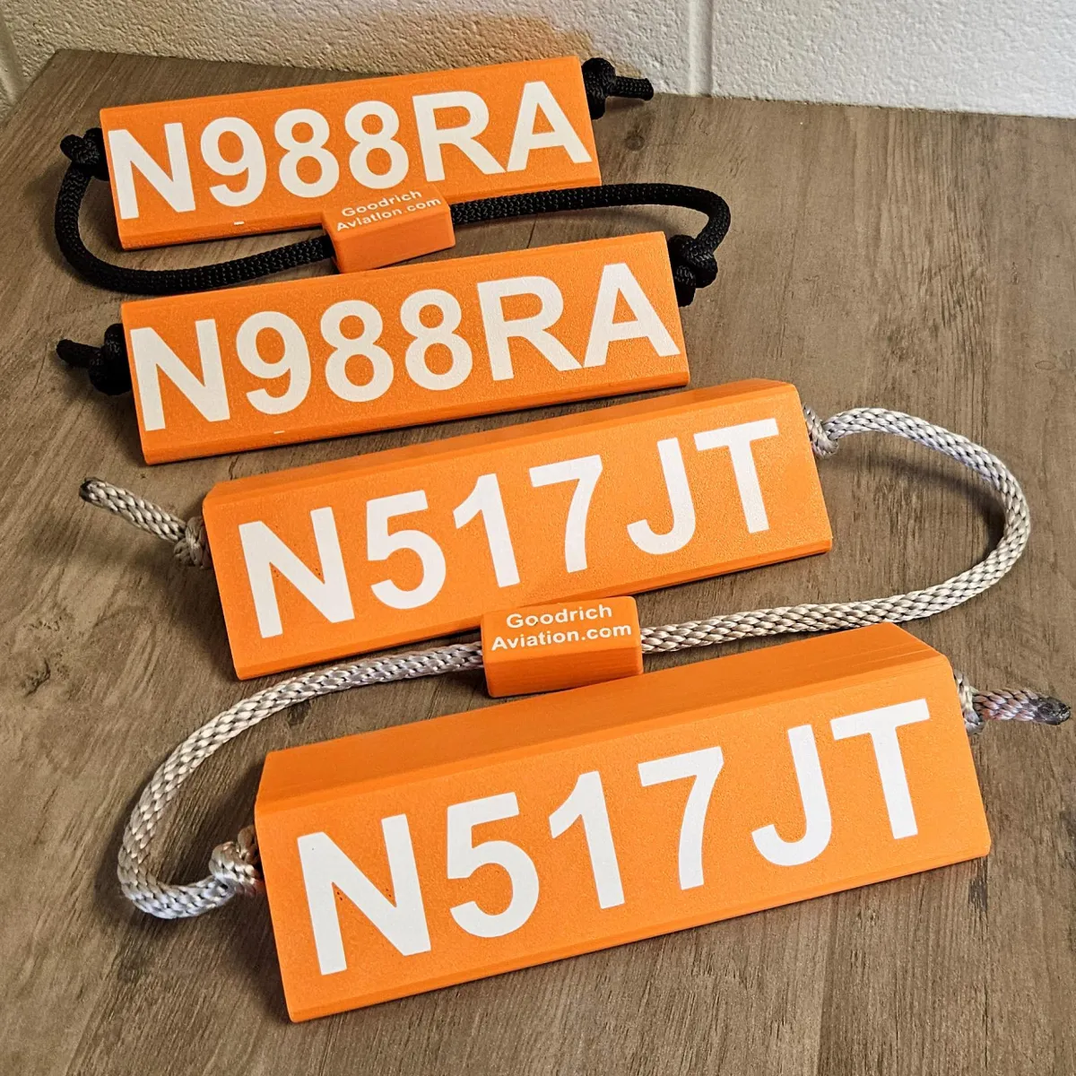 Orange base white letters gray rope
