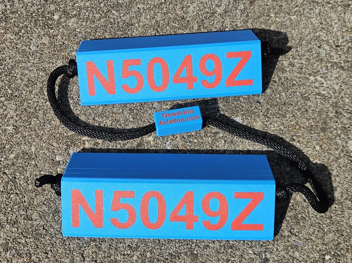 Light blue base red letters black rope