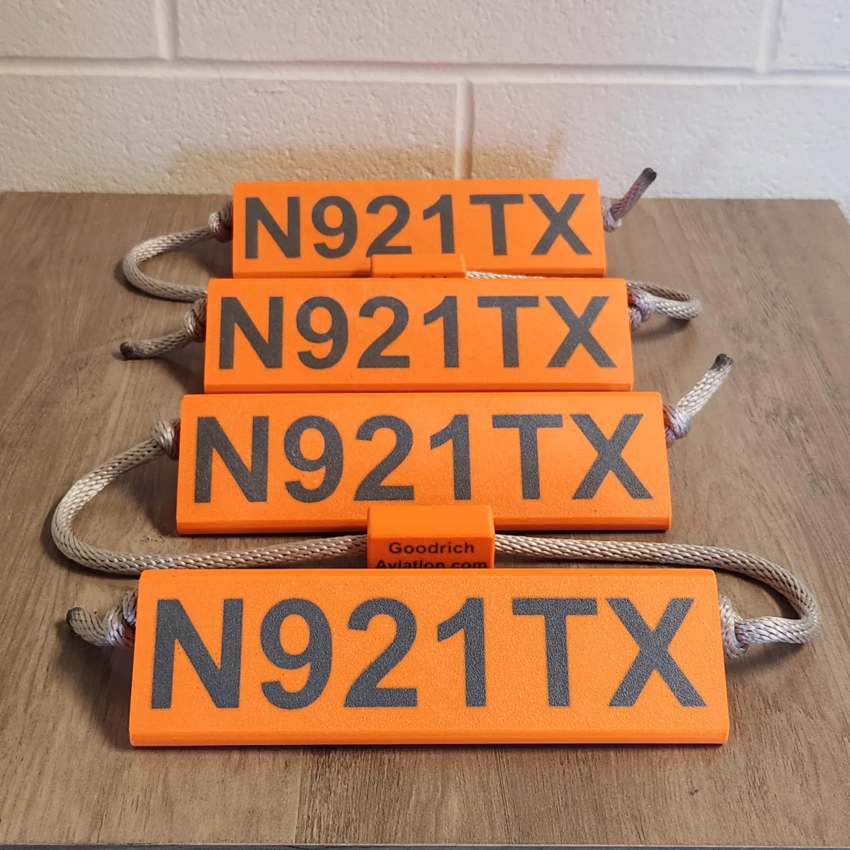 Orange base dark gray letters gray rope