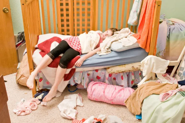 Young girl in a messy room