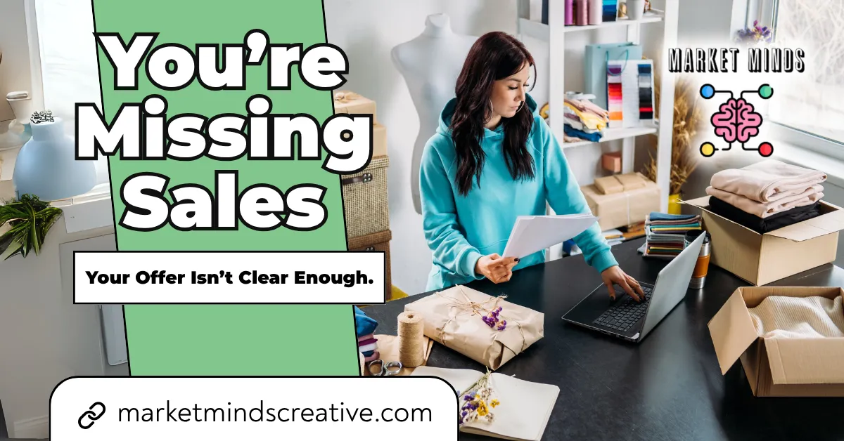 A woman in a light blue hoodie works on a laptop at a desk surrounded by wrapped packages, suggesting an e-commerce business. Green text overlay reads "You're Missing Sales," with a white box below stating "Your Offer Isn't Clear Enough." The Market Minds Creative logo and website are also visible.