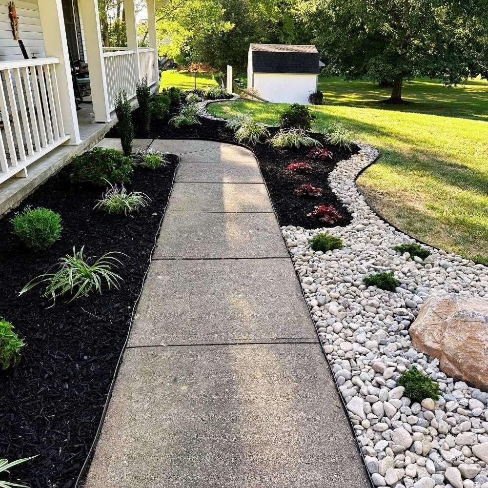 Fresh mulch and plant bed edging create a polished look in Alexandria, KY.