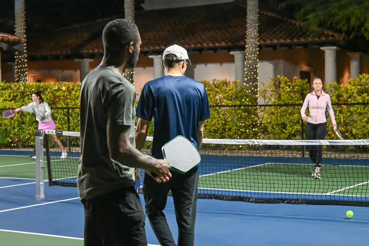 image of friends playing on a backyard pickleball court in Arizona