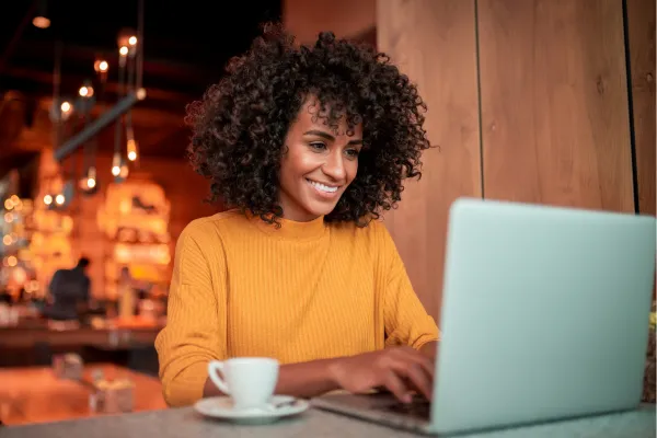 Woman searching for businesses online – represents the importance of having a Google My Business profile.