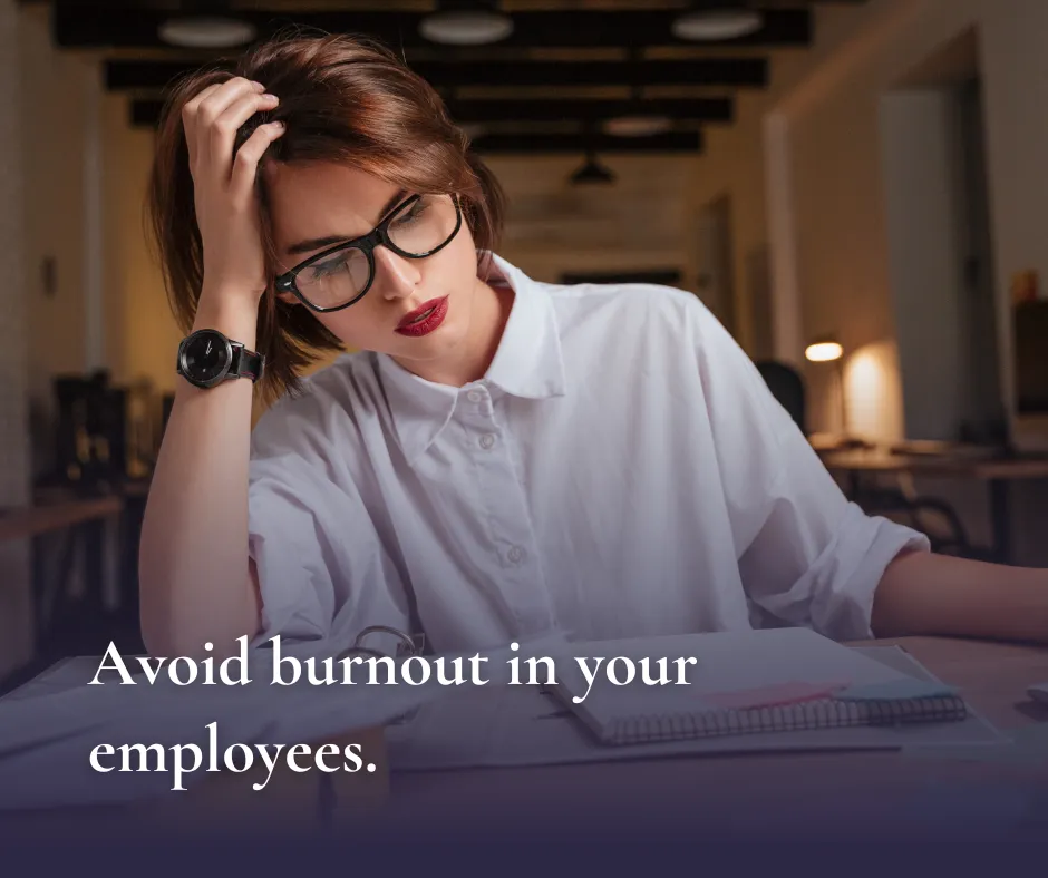 Woman sitting at a desk looking apathetic. Words say Avoid Burnout in your employees