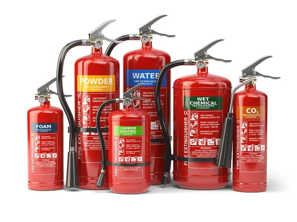 Six red fire extinguishers