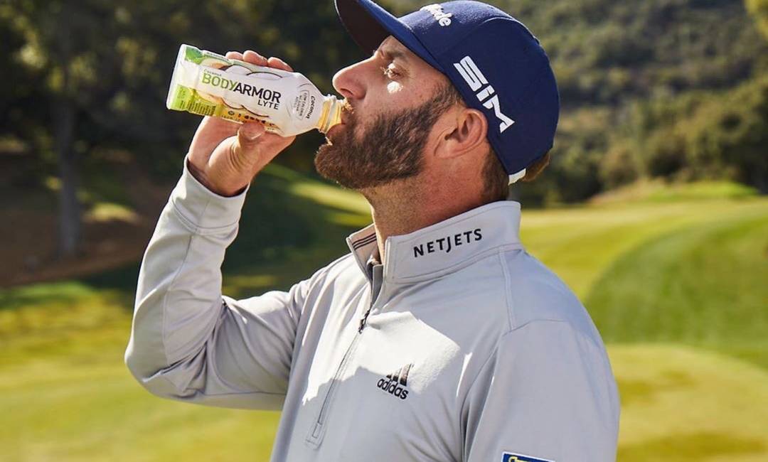 Dustin Johnson drinking a sports drink