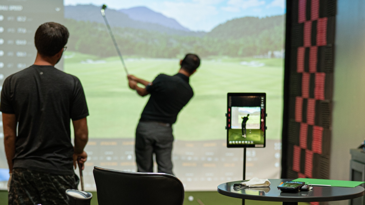 man swinging golf club