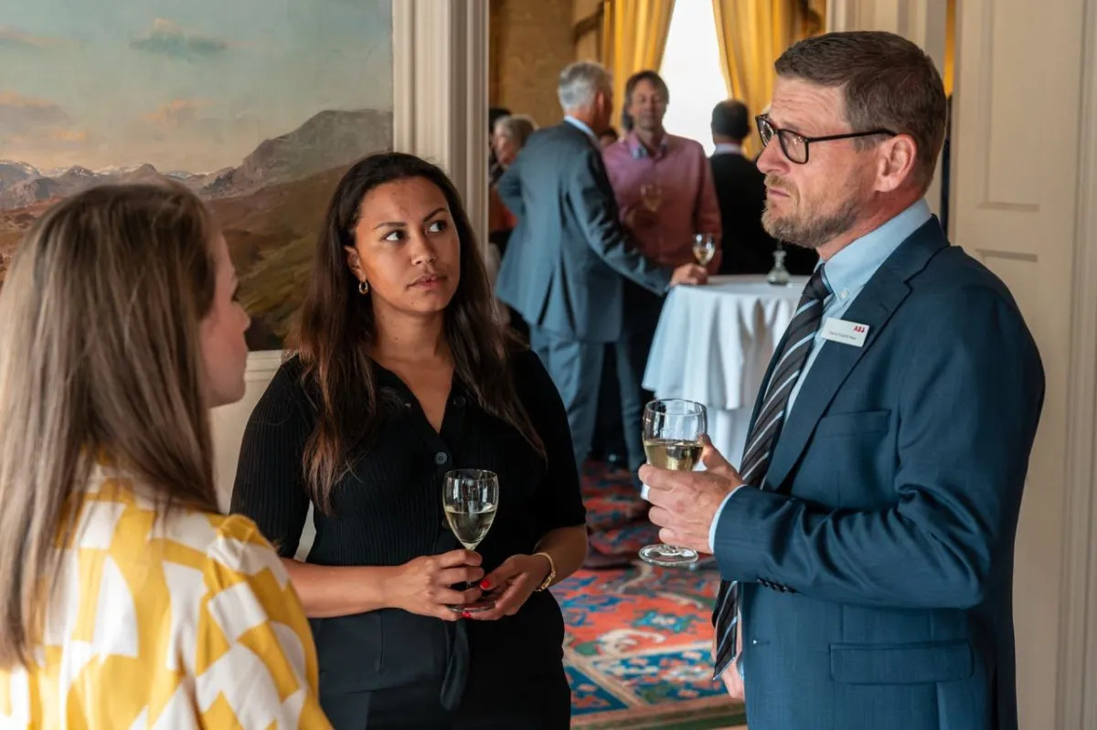 Attendees networking during post-event reception at the UK Ambassador to Norway's residence in Oslo