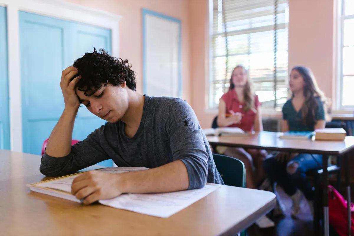 overwhelmed teen at school