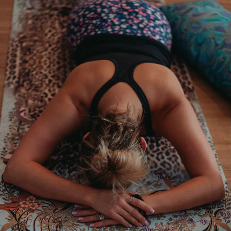 Person moving mindfully through a yoga practice, symbolising adaptability, openness and confidence in navigating change.