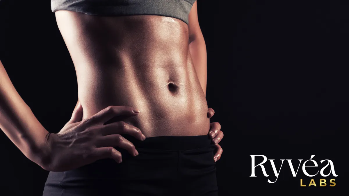 Close-up of a toned female midsection with hands on hips, symbolizing recovery, strength, and the potential healing benefits of peptides like BPC-157 and TB-500—featured in Ryvéa Labs’ research-based article.