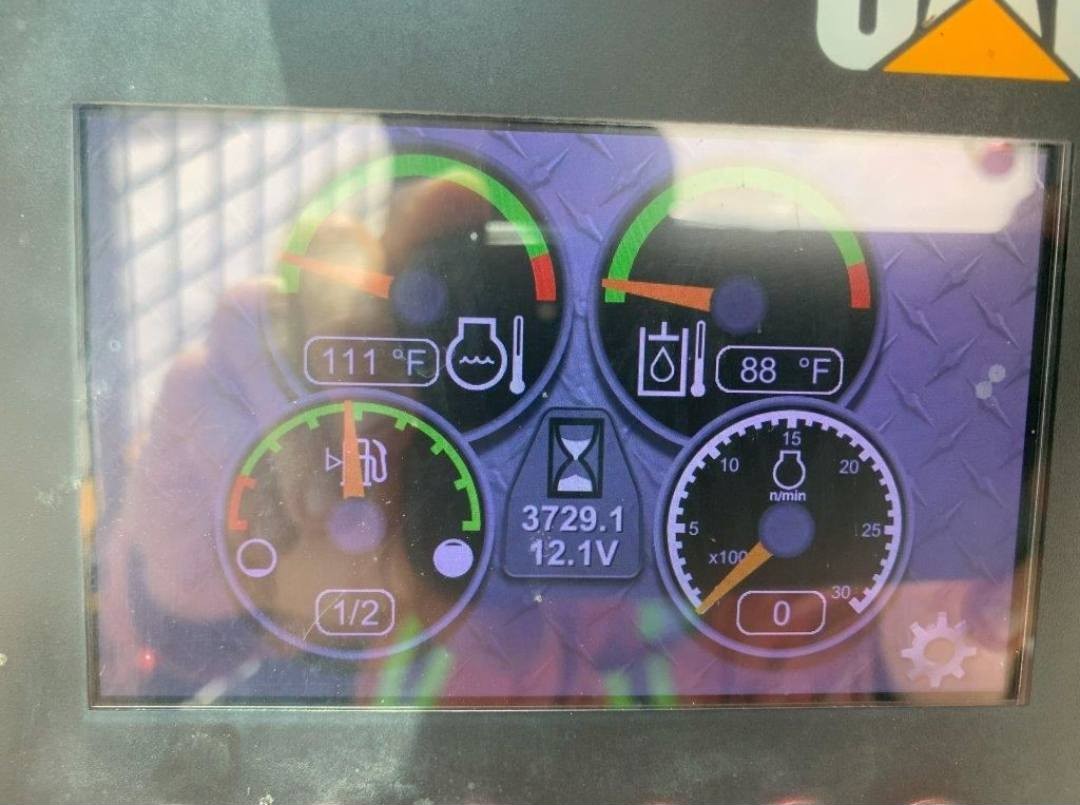 2016 CAT 246D operator dashboard showing instrument gauges and hydraulic controls