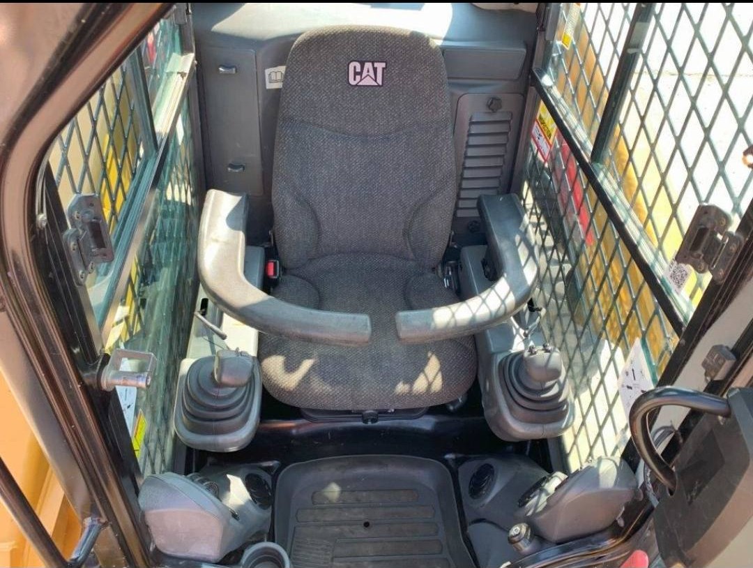 2016 CAT 246D operator dashboard showing instrument gauges and hydraulic controls