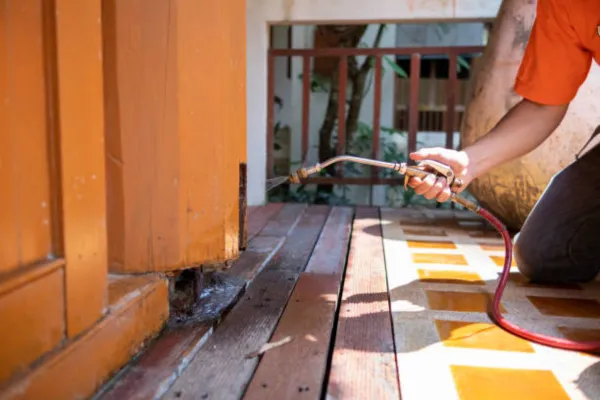 man cleaning a wooden floor