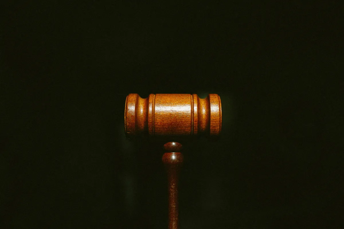 wooden gavel close up on black background