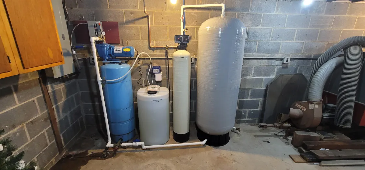 A sleek and modern water softener system newly installed in a home utility room, showcasing the latest technology for transforming hard water into soft, clean water.