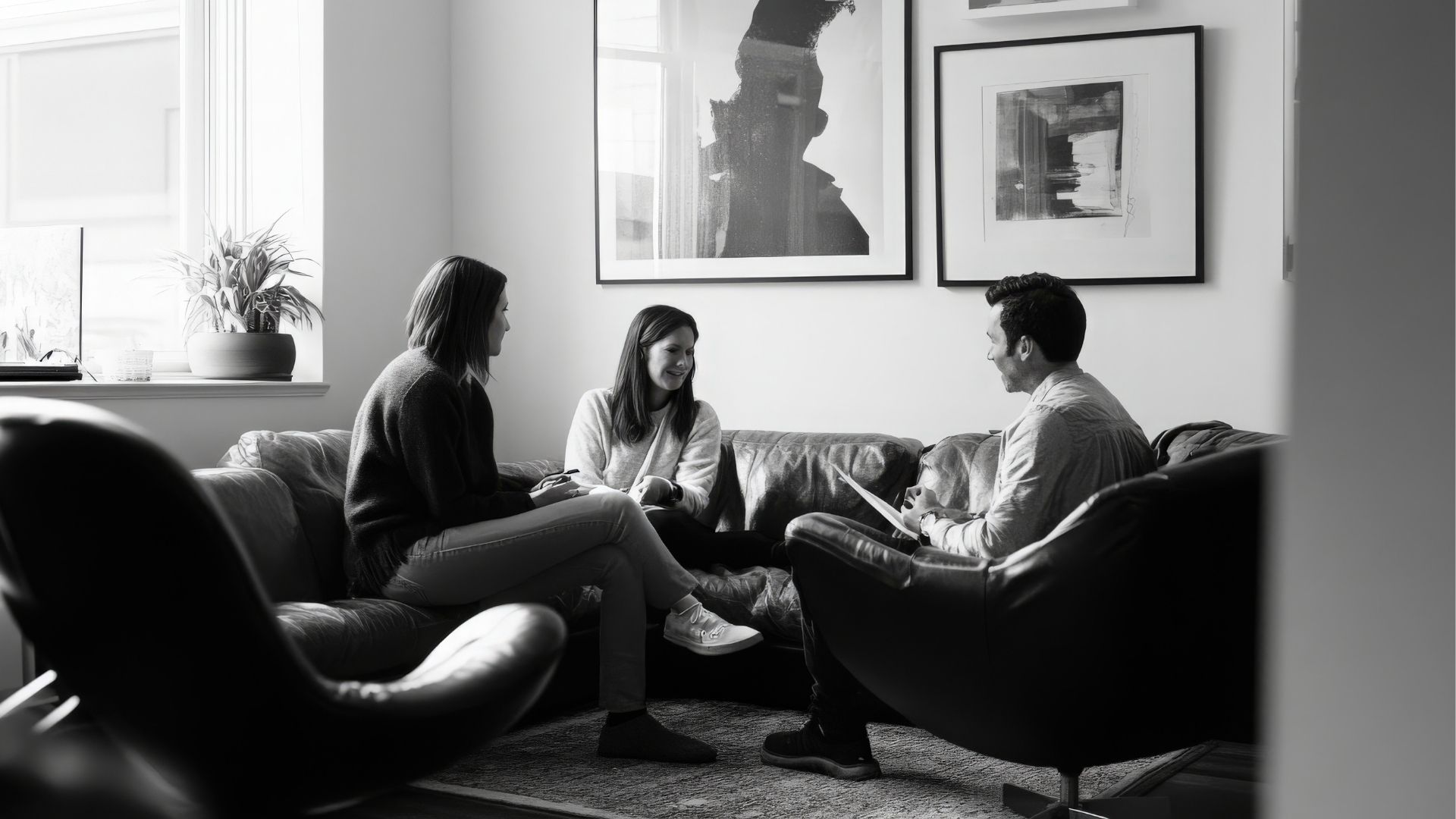 Therapist leading a community mental health non-profit sustainability meeting