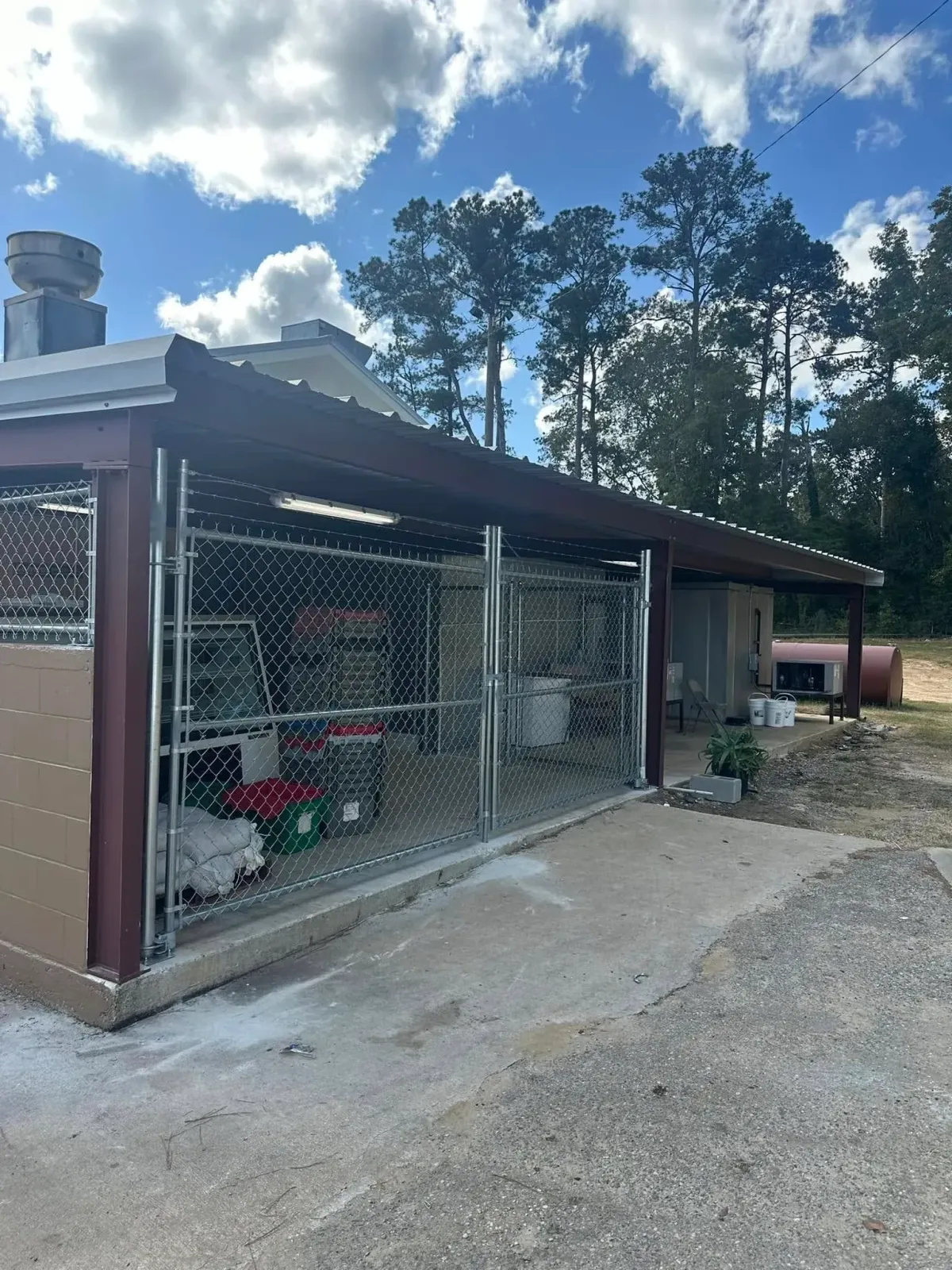Spacious and secure galvanized chain link dog kennels constructed by MCM Fence LLC at a Georgia facility.