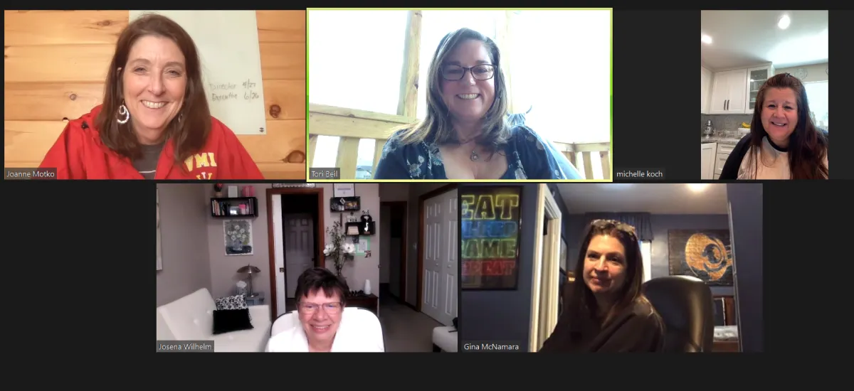 Five women engaging in conversation on a zoom call