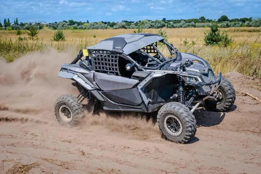 A powerful street-legal UTV in action, showing off its capabilities on dirt tracks, perfect for road and off-road use.