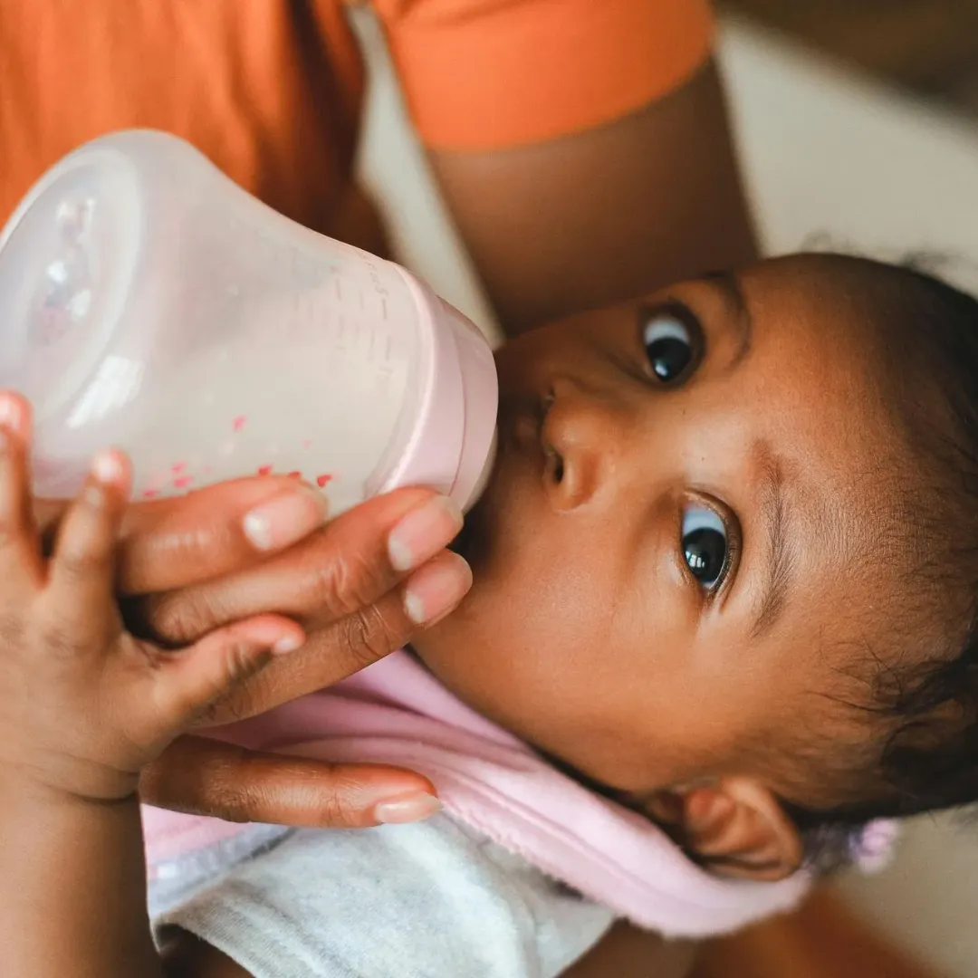 A baby being fed