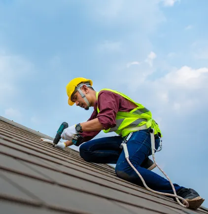 Roofer working in the roof