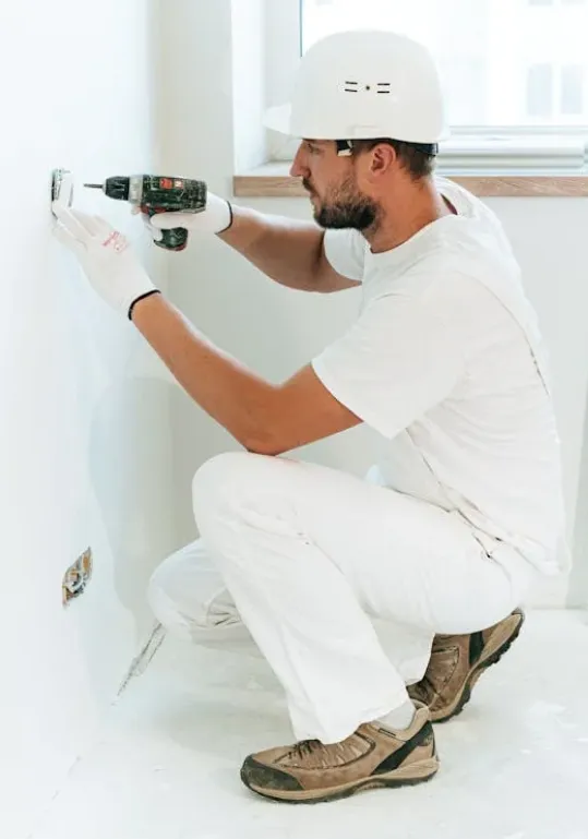 Electrician working the panel