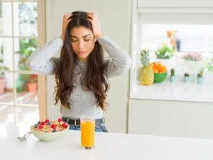 woman long brown hair headache