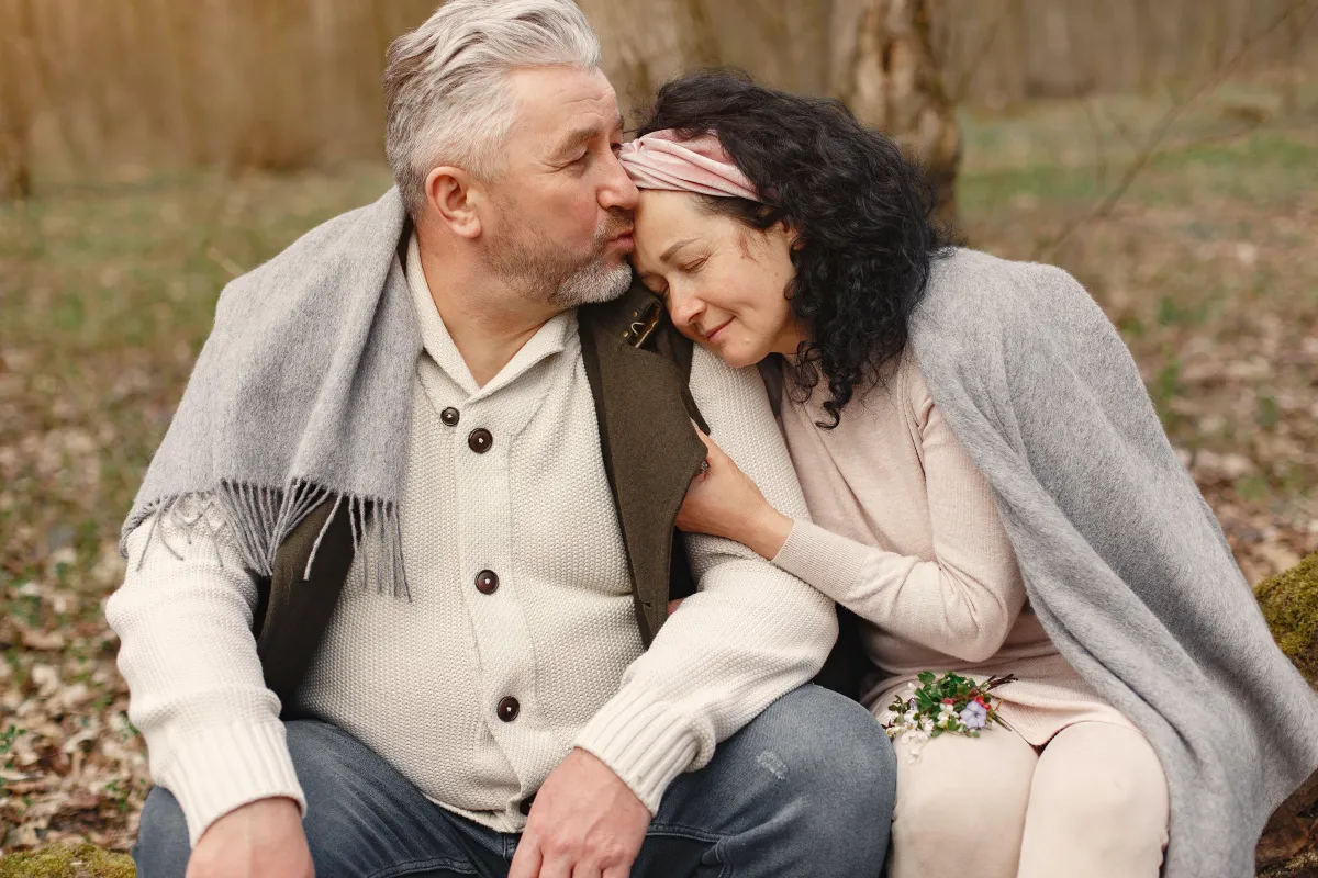 a couple sitting on a bench