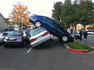 Two cars crashed in a parking lot